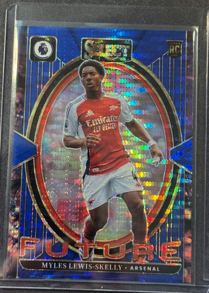 Front of 2024-25 Panini Select Premier League Soccer MYLES LEWIS-SKELLY #7 Silver Prizm, front of a soccer card. Top row: black rounded-square Premier League lion logo (left), metallic foil 'SELECT' wordmark with small '24' and '25'…