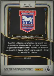 Back of 2024-25 Panini Select Premier League Soccer Omari Hutchinson #120 Mezzanine Prizm, upright portrait-format card back. A large Ipswich Town crest is centered in the upper half on a black background. The player name OMARI HUTCHINSON…