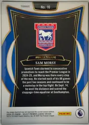 Back of 2024-25 Panini Select Premier League Soccer Sam Morsy #16 Base, landscape-oriented card back shown upright. A white border surrounds an ornate blue, black, and gold design. The Ipswich Town crest is centered in…