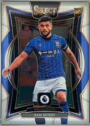 Front of 2024-25 Panini Select Premier League Soccer Sam Morsy #16 Base, front of a portrait soccer card. The SELECT logo and 24/25 25/26 year text are centered at the top, with a Rookie RC Card badge in the upper-right…