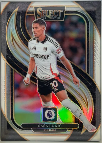 Front of 2024-25 Panini Select Premier League Soccer SAŠA LUKIĆ #123 Mezzanine Prizm, upright portrait soccer card front. A full-body image of Saša Lukić in a white Fulham kit dominates the center. The SELECT logo is printed in a…