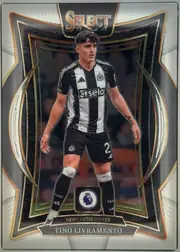 Front of 2024-25 Panini Select Premier League Soccer Tino Livramento #90 Terrace, upright portrait football card. A Newcastle United player in black-and-white kit is pictured full length against a dark stadium background. The top…