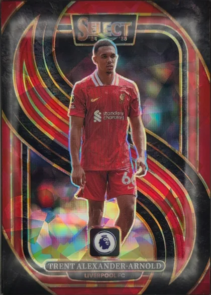 Front of 2024-25 Panini Select Premier League Soccer Trent Alexander-Arnold #145 Mezzanine Prizm, portrait soccer card front featuring Trent Alexander-Arnold standing centrally in a red Liverpool kit. The background is dark with sweeping…