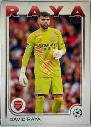 Front of 2024-25 Topps UEFA Club Competitions Soccer David Raya #154 Base, portrait soccer card front. A full-body image of David Raya in a bright lime Arsenal goalkeeper uniform occupies the central image area, with a…