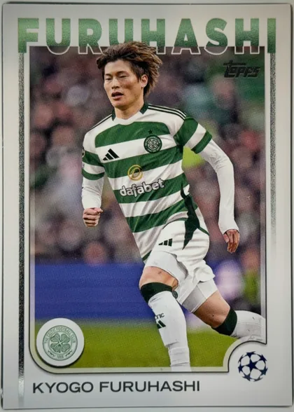 Front of 2024-25 Topps UEFA Club Competitions Soccer Kyogo Furuhashi #140 Base, front of a soccer trading card. A full-length action photograph of a player in a green-and-white hooped Celtic home kit (Adidas three-stripe…