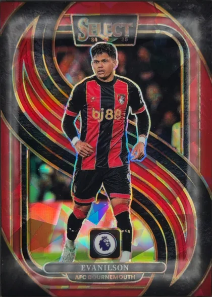 Front of 2024 Panini Select Premier League Evanilson #161 Prizm Mezzanine, front of a soccer card. A die-cut action photo of a player in a black-and-red vertically striped jersey with the gold 'bj88' chest sponsor and an…