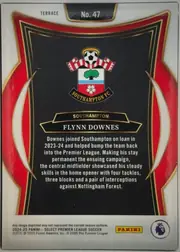Back of 2024 Panini Select Premier League Flynn Downes #47, upright portrait-format card back. A white top and bottom border frames a black central panel with red side panels and thin gold decorative lines…