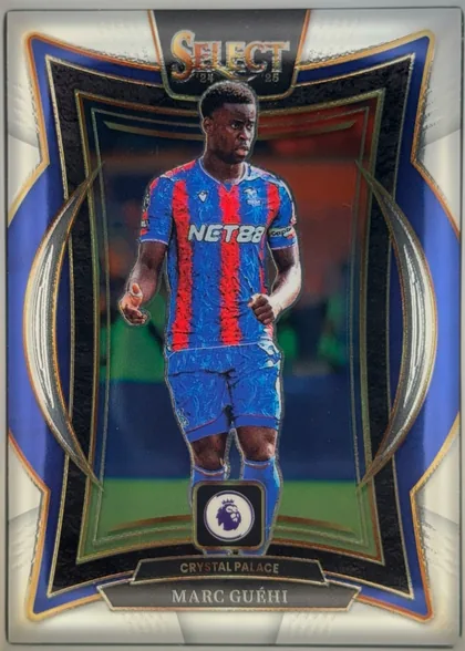 Front of 2024 Panini Select Premier League Marc Guéhi #78 Base Terrace, portrait-oriented soccer card front. A large central image shows a player in a blue-and-red striped Crystal Palace kit on a stadium background. The…