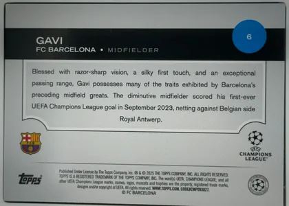 Back of 2024 Topps UEFA GAVI #6, upright horizontal biography back. A dark charcoal header spans the upper portion, with the white name "GAVI" at left, "FC BARCELONA • MIDFIELDER"…