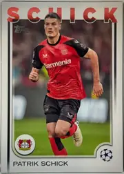 Front of 2024 Topps UEFA Patrik Schick #67, front of a soccer trading card. A full-bleed action photograph shows a player in a red-and-black Bayer Leverkusen home kit (white 'Barmenia' chest…