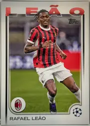 Front of 2024 Topps UEFA Rafael Leão #11 Base, front of a soccer card. A full-length action photograph of a player in an AC Milan red-and-black vertically striped jersey with white shorts and…