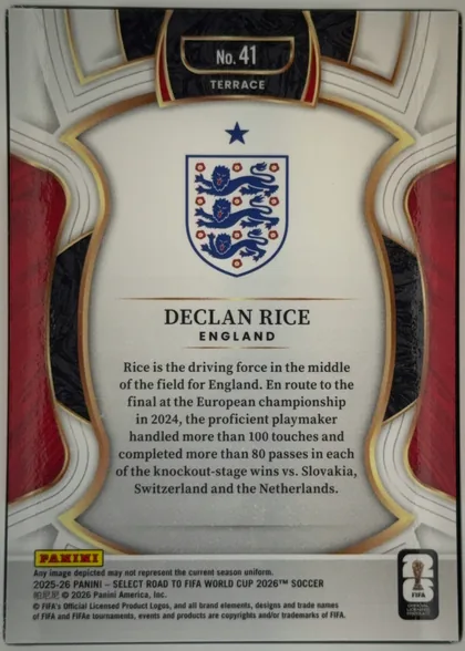 Back of 2025-26 Panini - Select Road to FIFA World Cup 2026 Soccer Declan Rice #41 Terrace, upright portrait-oriented card back. A decorative white, gray, gold, red, and black frame surrounds a large cream central panel. The top center…