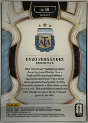 Back of 2025-26 Panini - Select Road to FIFA World Cup 2026 Soccer Enzo Fernández #58 Base Terrace, back of a soccer trading card. An ornate white, light-gray, gold, dark-blue, and black symmetrical border surrounds a cream central panel. At the…