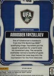 Back of 2026 Panini Prizm FIFA Abbosbek Fayzullaev #448, back of a soccer card with a dark blue patterned field, white and silver rounded frame graphics, and a central white panel. The Uzbekistan Football…