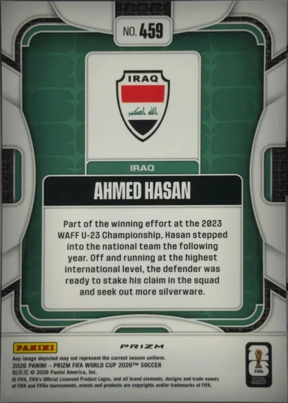 Back of 2026 Panini Prizm FIFA Ahmed Hasan #459, back of a soccer card oriented upright. A dark green patterned background is framed by rounded white lines. At the top center is a white label…