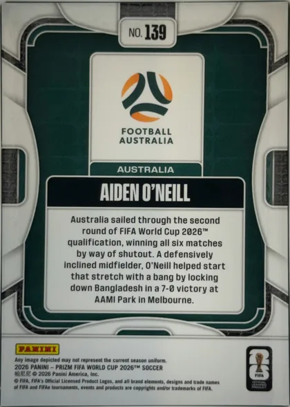 Back of 2026 Panini Prizm FIFA Aiden O’Neill #139 Base, upright portrait-oriented card back. A dark green field is framed by rounded white decorative border lines. At the top center is a white label…