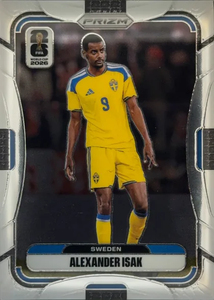 Front of 2026 Panini Prizm FIFA Alexander Isak #494, front of a soccer card. Top center shows a hexagonal 'PRIZM' logo. Top-left shows a '26 FIFA WORLD CUP 2026' emblem. Center is a full-body photo of…