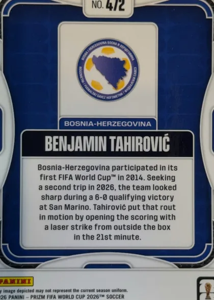 Back of 2026 Panini Prizm FIFA Benjamin Tahirovic #472 Base, landscape-oriented card back with a dark blue background and white rounded border decorations. A Bosnia-Herzegovina crest is centered in the upper…