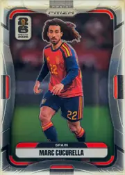 Front of 2026 Panini Prizm FIFA Marc Cucurella #74 Base, portrait soccer card front. A full-body action photograph of Marc Cucurella in a red-and-blue Spain kit occupies the center. The top has a PANINI…