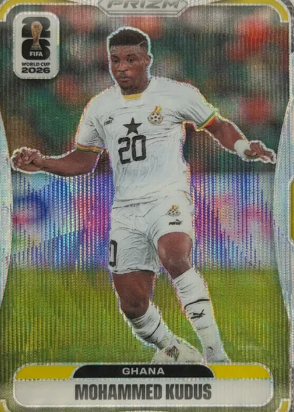Front of 2026 Panini Prizm FIFA Mohammed Kudus #229, upright portrait soccer card. A Ghana player in a white kit with number 20 is shown in action against a colorful stadium background with a…