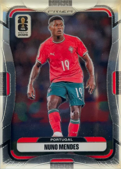 Front of 2026 Panini Prizm FIFA Nuno Mendes #354 Silver Prizm, front of a soccer card. A full-body action photo of a player in a red Portugal jersey (number 19), teal-green shorts (number 19) and red socks, set…