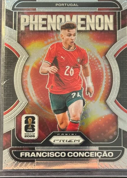 Front of 2026 Panini Prizm FIFA Phenomenon FRANCISCO CONCEIÇÃO #6, front-facing portrait soccer card. PORTUGAL appears in a black rounded header at the top, with FRANCISCO CONCEIÇÃO in a matching black nameplate at…