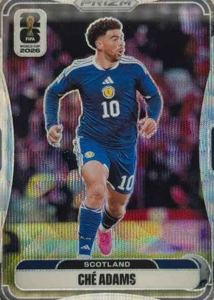 Front of 2026 Panini Prizm FIFA Soccer Cards CHÉ ADAMS #391, upright portrait soccer card front. A male Scotland player wearing a blue number 10 kit runs in front of a colorful stadium background. The PRIZM…
