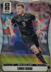 Front of 2026 Panini Prizm FIFA Soccer Cards Chris Wood #320 Prizm refractor (rainbow/holographic), front of a soccer card. A full-body action photo of a male player in a black New Zealand (All Whites) kit with the number 9 on the chest and a…