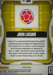 Back of 2026 Panini Prizm FIFA Soccer Cards Jhon Lucumí #184, back of a portrait-oriented soccer card. A gold/yellow patterned field surrounds a large white panel containing the Federación Colombiana de Fútbol…