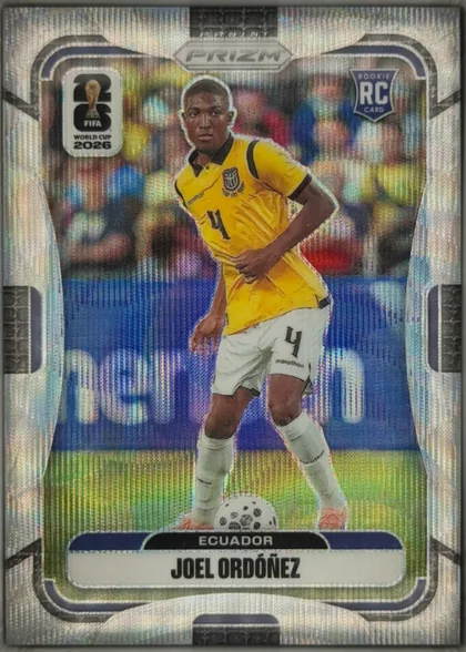 Front of 2026 Panini Prizm FIFA Soccer Cards JOEL ORDÓÑEZ #211, portrait soccer card front. A player in Ecuador's yellow kit is pictured running with a soccer ball on a blurred stadium background. The PRIZM logo…