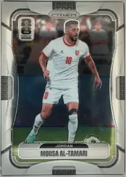 Front of 2026 Panini Prizm FIFA Soccer Cards Mousa Al-Tamari #270 Prizm, portrait-format soccer card front. A full-body action photograph shows Mousa Al-Tamari in a white Jordan kit with red trim and number 10, against a…