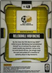 Back of 2026 Panini Prizm FIFA Soccer Cards Relebohile Mofokeng #410, landscape-oriented card back shown upright. A white and black geometric outer design surrounds a yellow-green patterned inner field. The upper…
