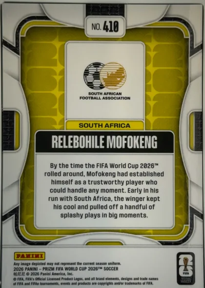 Back of 2026 Panini Prizm FIFA Soccer Cards Relebohile Mofokeng #410, landscape-oriented card back shown upright. A white and black geometric outer design surrounds a yellow-green patterned inner field. The upper…