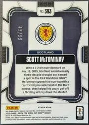 Back of 2026 Panini Prizm FIFA Soccer Cards Scott McTominay #393 Blue prismatic foil, upright landscape-oriented card back with a large dark navy central field enclosed by layered white, gray, black, and navy geometric borders. Card…
