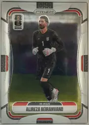 Front of 2026 Panini Prizm FIFA World Cup Soccer Alireza Beiranvand #244, front of a soccer card. Top center has a silver hexagonal badge reading 'PRIZM'. Upper left carries a white rounded logo with the FIFA World Cup…