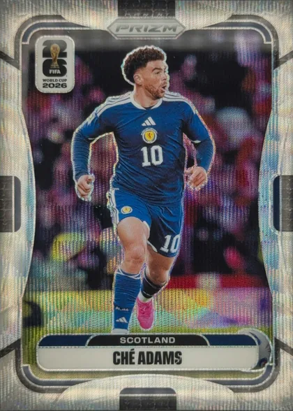 Front of 2026 Panini Prizm FIFA World Cup Soccer CHÉ ADAMS #391, portrait soccer card front. A full-body image of Ché Adams in a blue Scotland uniform, wearing number 10, runs against a blurred stadium background…