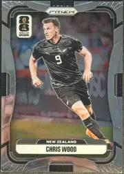 Front of 2026 Panini Prizm FIFA World Cup Soccer Chris Wood #320, portrait soccer card front. A centered action image shows Chris Wood in a black New Zealand kit with number 9. The top has PANINI branding and a…