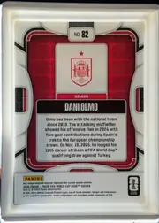 Back of 2026 Panini Prizm FIFA World Cup Soccer DANI OLMO #82 Base, portrait-format card back with a predominantly white and light-gray outer frame. A black and red rounded rectangular frame surrounds a red patterned…