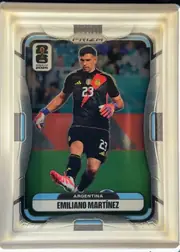 Front of 2026 Panini Prizm FIFA World Cup Soccer Emiliano Martínez #2 Base, upright portrait soccer card front. A centered photograph shows Emiliano Martinez in Argentina's black goalkeeper kit, with the number 23 visible…