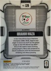 Back of 2026 Panini Prizm FIFA World Cup Soccer Ibrahim Maza, upright card back. A gray rounded-tile lattice fills the field, framed left and right by white curved arch panels that each hold a small dark grid…