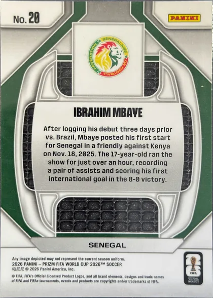Back of 2026 Panini Prizm FIFA World Cup Soccer Ibrahima Mbaye #26 Rookie Card, back side of a soccer trading card. A silver-gray and dark-green geometric frame surrounds a central white panel with the Senegal federation crest…