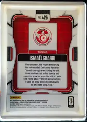 Back of 2026 Panini Prizm FIFA World Cup Soccer ISMAËL GHARBI #426, portrait-oriented card back. A white and gray mechanical-style frame surrounds a red patterned central panel. The card number appears in a white…