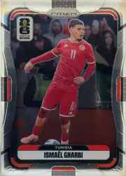 Front of 2026 Panini Prizm FIFA World Cup Soccer ISMAËL GHARBI #426, upright portrait soccer card front. A full-body player image appears against a dark stadium background. The top center has a silver PRIZM logo, the…