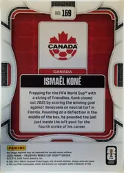 Back of 2026 Panini Prizm FIFA World Cup Soccer Ismael Koné #169 Base, back of a soccer trading card. A red geometric patterned background is enclosed by white rounded border lines. At the upper center is a white number…
