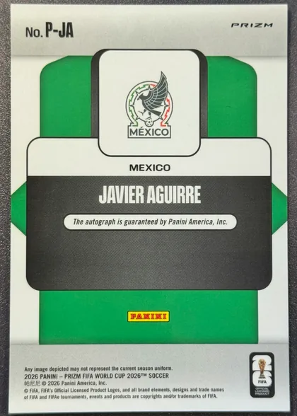 Back of 2026 Panini Prizm FIFA World Cup Soccer Javier Aguirre #P-JA Penmanship autograph autographed, portrait-oriented card back. The upper-left shows "No. P-JA" and the upper-right shows italic Prizm branding. A Mexico crest is centered near the…