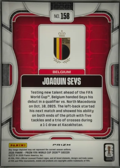 Back of 2026 Panini Prizm FIFA World Cup Soccer Joaquin Seys #158 Prizm (refractor), upright portrait-oriented card back. A white-and-silver framed design surrounds a red patterned background with black textured accents. The top…