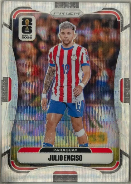 Front of 2026 Panini Prizm FIFA World Cup Soccer Julio Enciso #547 Prizm, front of a soccer card. A full-body action photo of a player in a red-and-white vertically striped jersey with blue trim, blue shorts, and number…