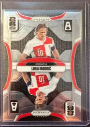 Front of 2026 Panini Prizm FIFA World Cup Soccer Luka Modrić #7, portrait soccer card front. A central image shows Luka Modric in a Croatia red-and-white national-team jersey, with the number 10 visible. The upper…