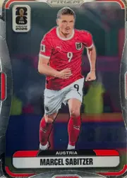 Front of 2026 Panini Prizm FIFA World Cup Soccer Marcel Sabitzer #144 Base, upright portrait soccer card front. A full-body image of Marcel Sabitzer in an Austria red jersey and white shorts fills the center. The FIFA World…