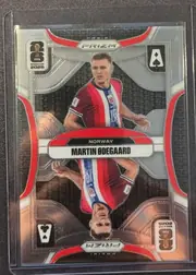 Front of 2026 Panini Prizm FIFA World Cup Soccer MARTIN ØDEGAARD #20, portrait soccer card front featuring Martin Ødegaard in a Norway kit. The player image occupies the center, with a metallic silver and gray…